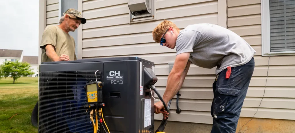 Two Gary Paul Mechanical Technicians Testing HVAC Unit